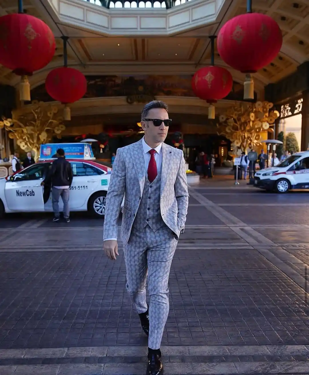 9. Grey Check Three Piece Suit with Red Tie