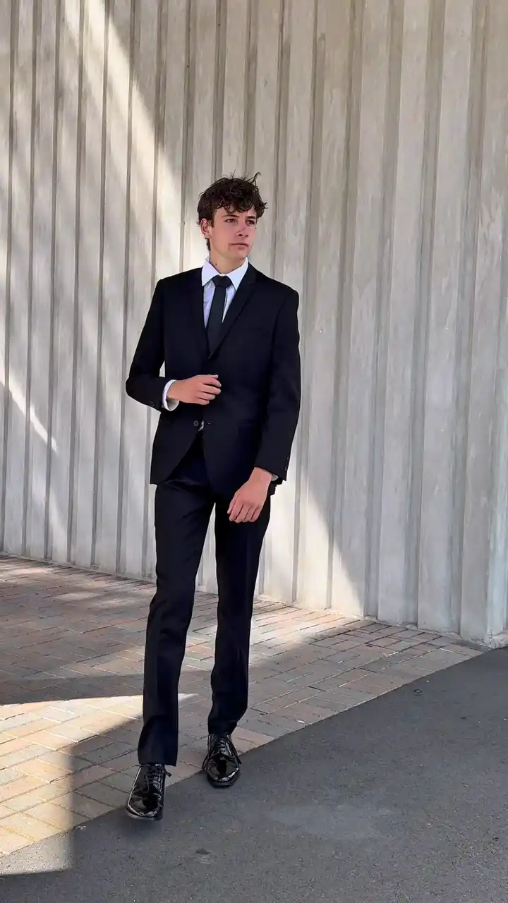 12. Classic Black Suit With Tie