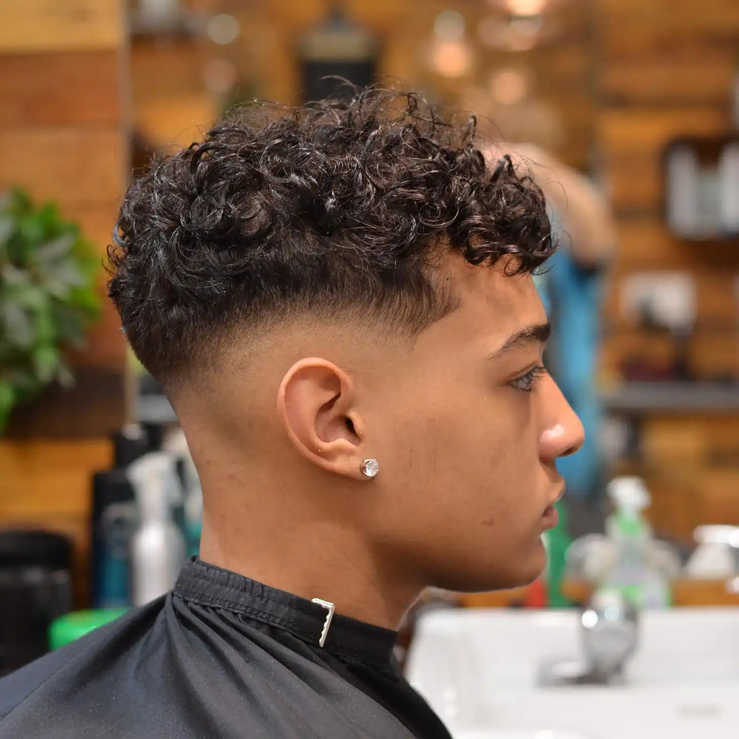 10. Mid Taper With a Sharp, Defined Curl Edge