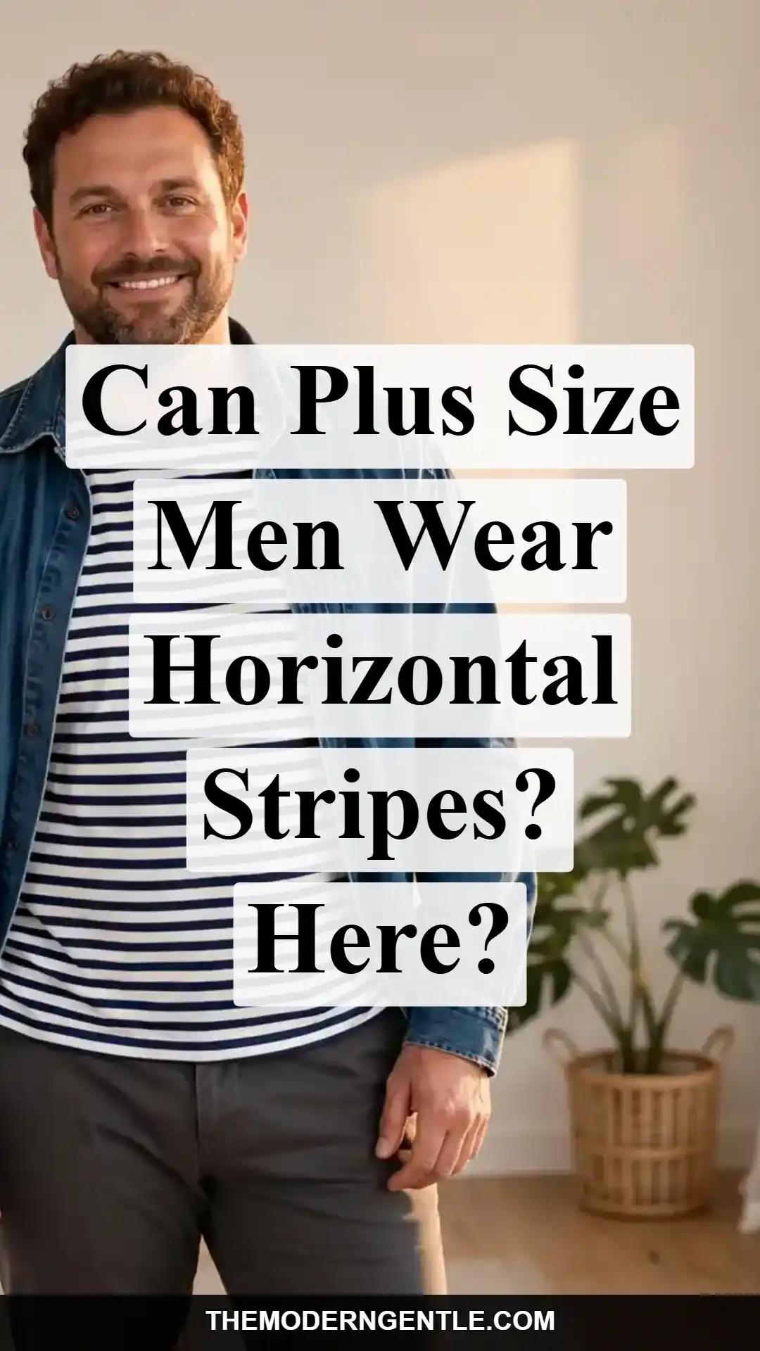 Photo of a plus size man with curly hair and a beard smiling while wearing a navy and white horizontal striped shirt layered under a denim jacket, against a light grey background. White text overlay reads "Can Plus Size Men Wear Horizontal Stripes? Here?" The image shows stripe width and color contrast that work for bigger builds, and breaks up the horizontal line with a vertical-opening layering piece.
