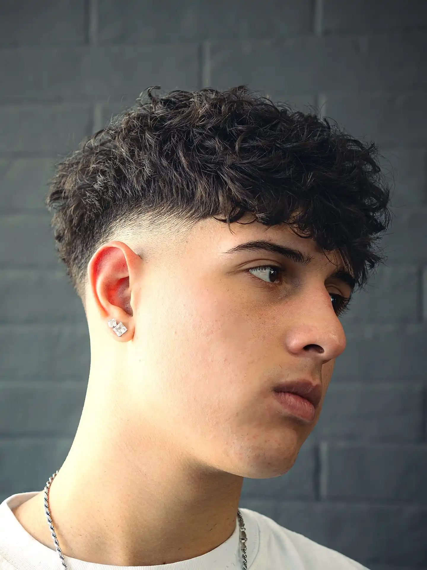4. This Curly Fringe Sits Heavier on One Side, and That's the Point