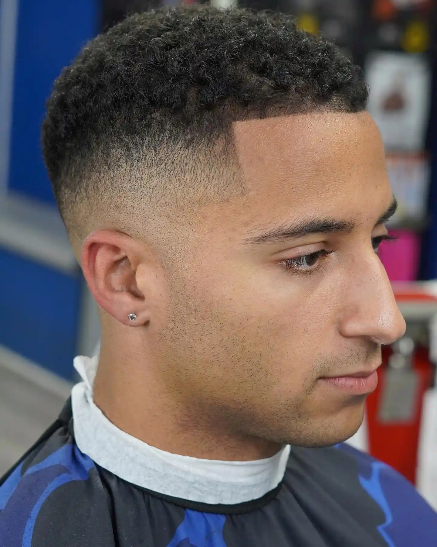 5. A Sharp, Blocked Hairline Turns This Mid Fade Into Something More Deliberate