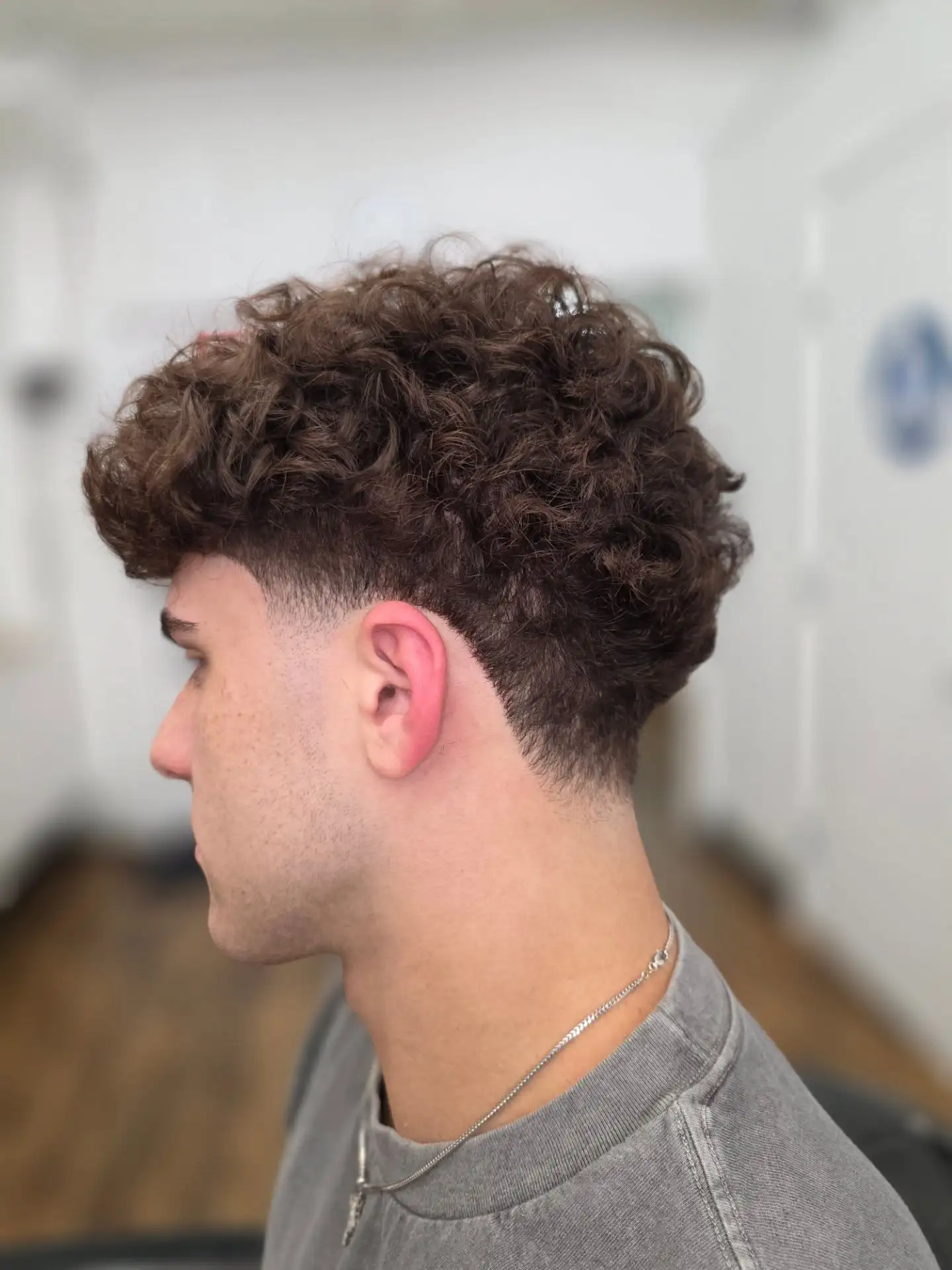 7. Warm Brown Curl Crop with Low Taper