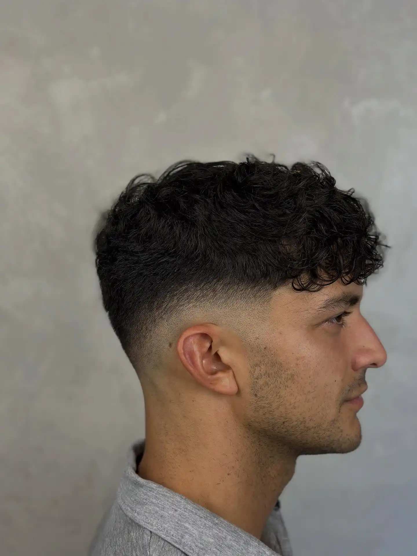 2. The Fringe Fade That Lets Curls Fall Right Over the Forehead