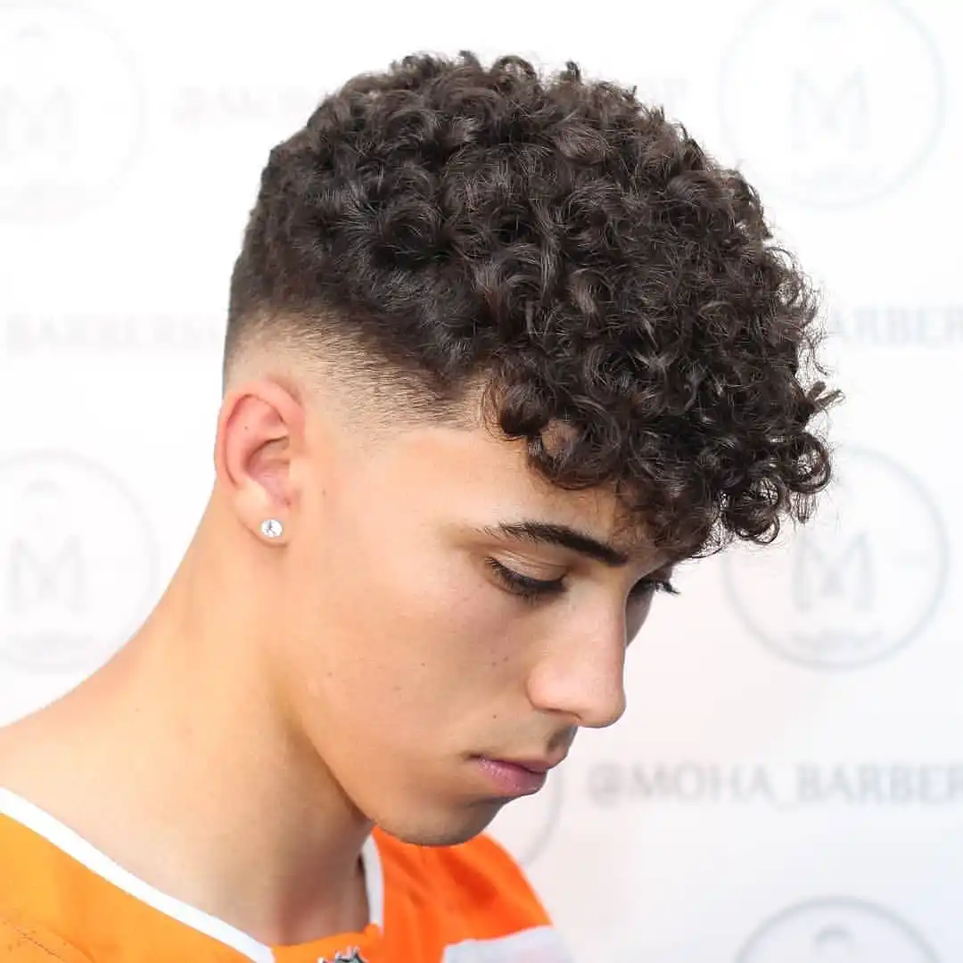 2. A Skin Fade Sharp Enough to Frame Every Curl