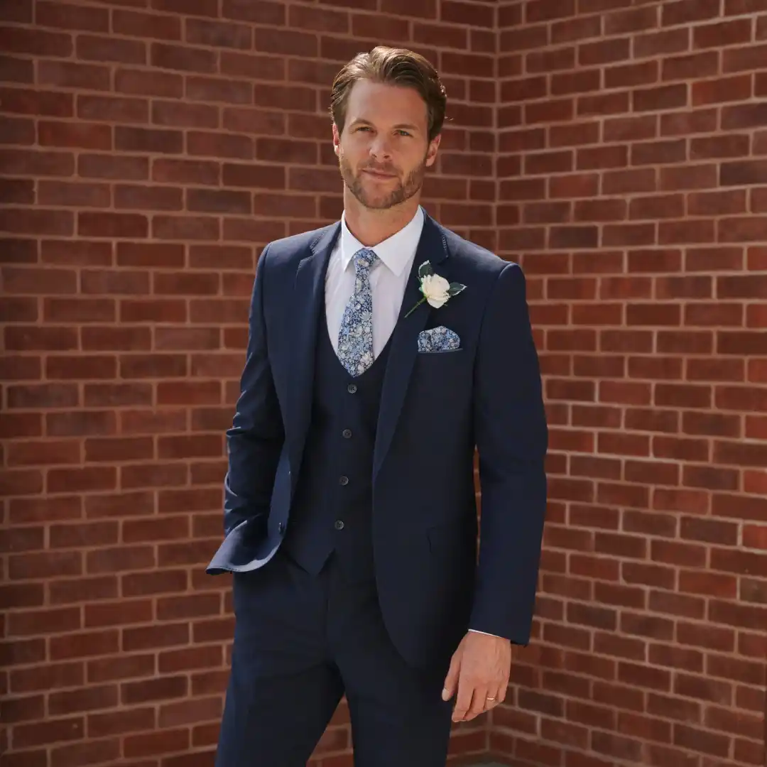 4. Navy Suit With Floral Tie