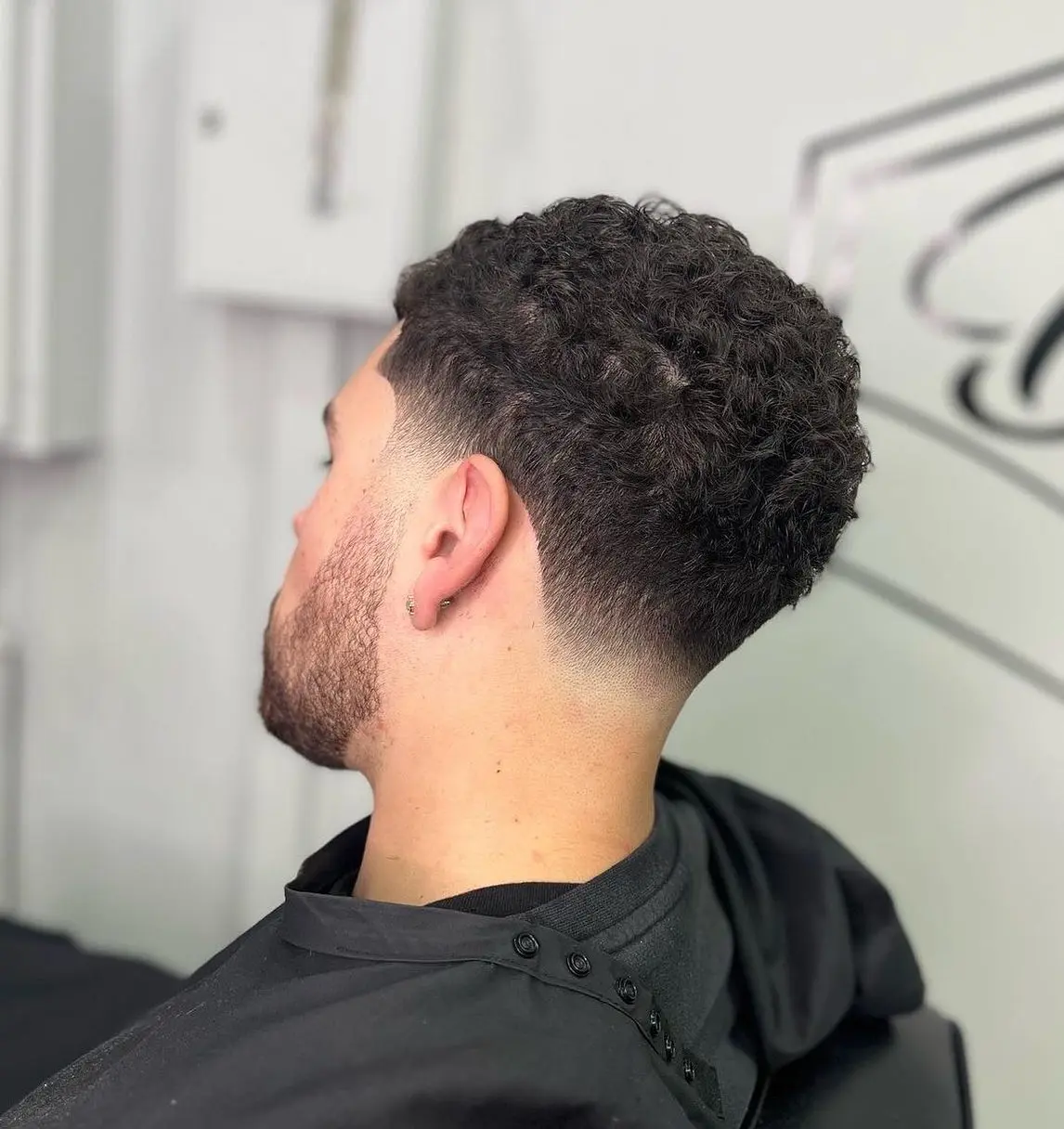 1. The Low Drop Fade That Lets Your Curls Pile Up on Top