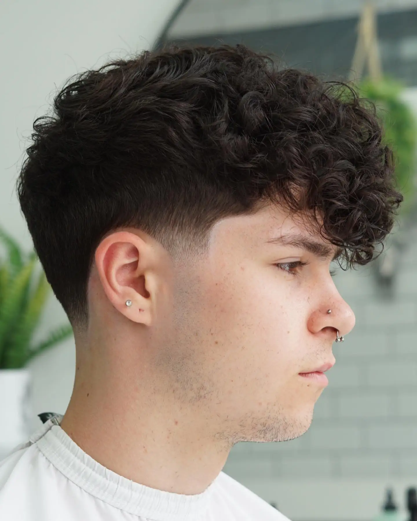 10. Long Curl Fringe with Precision Fade