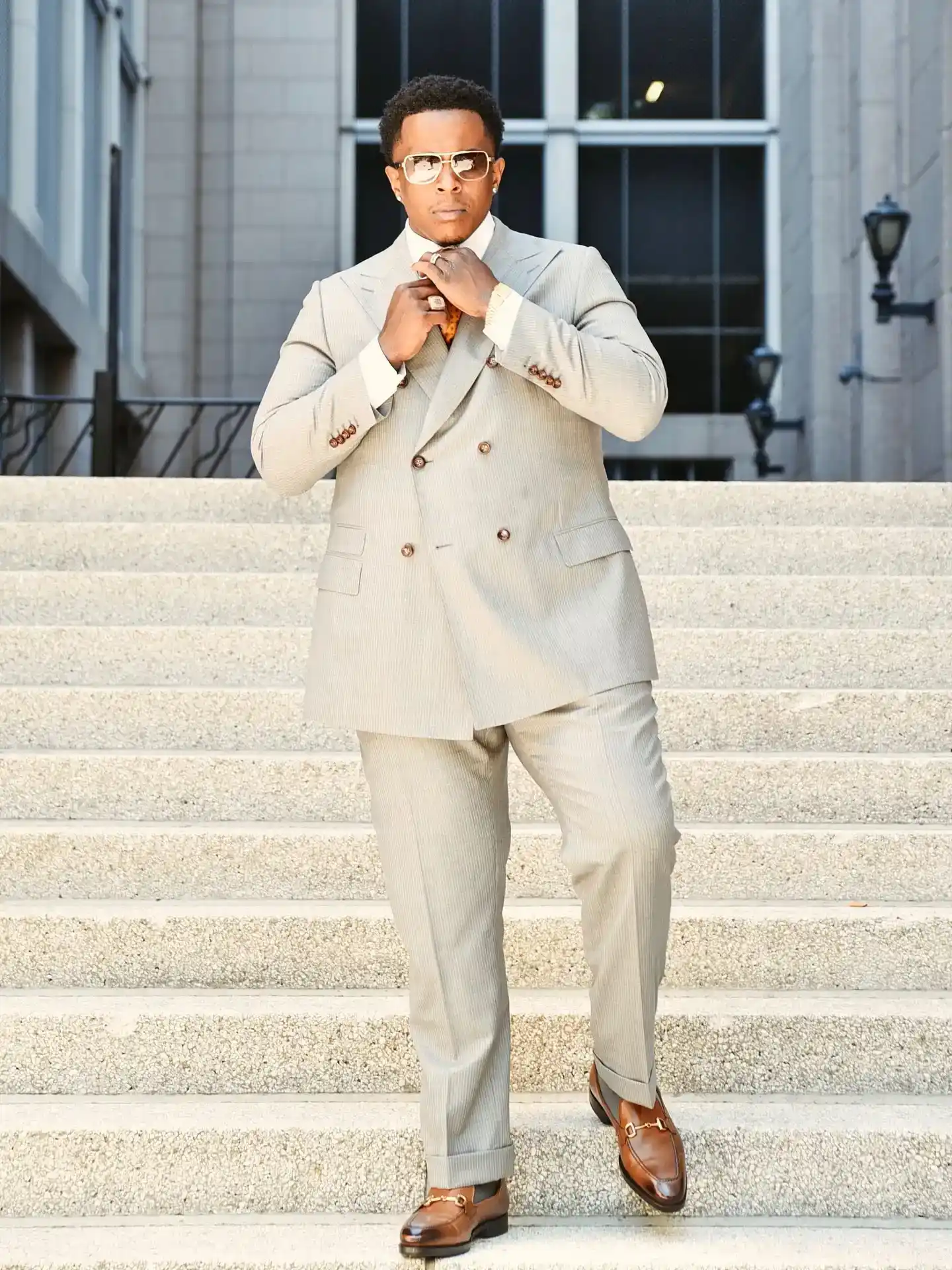8. Double Breasted Light Grey Suit