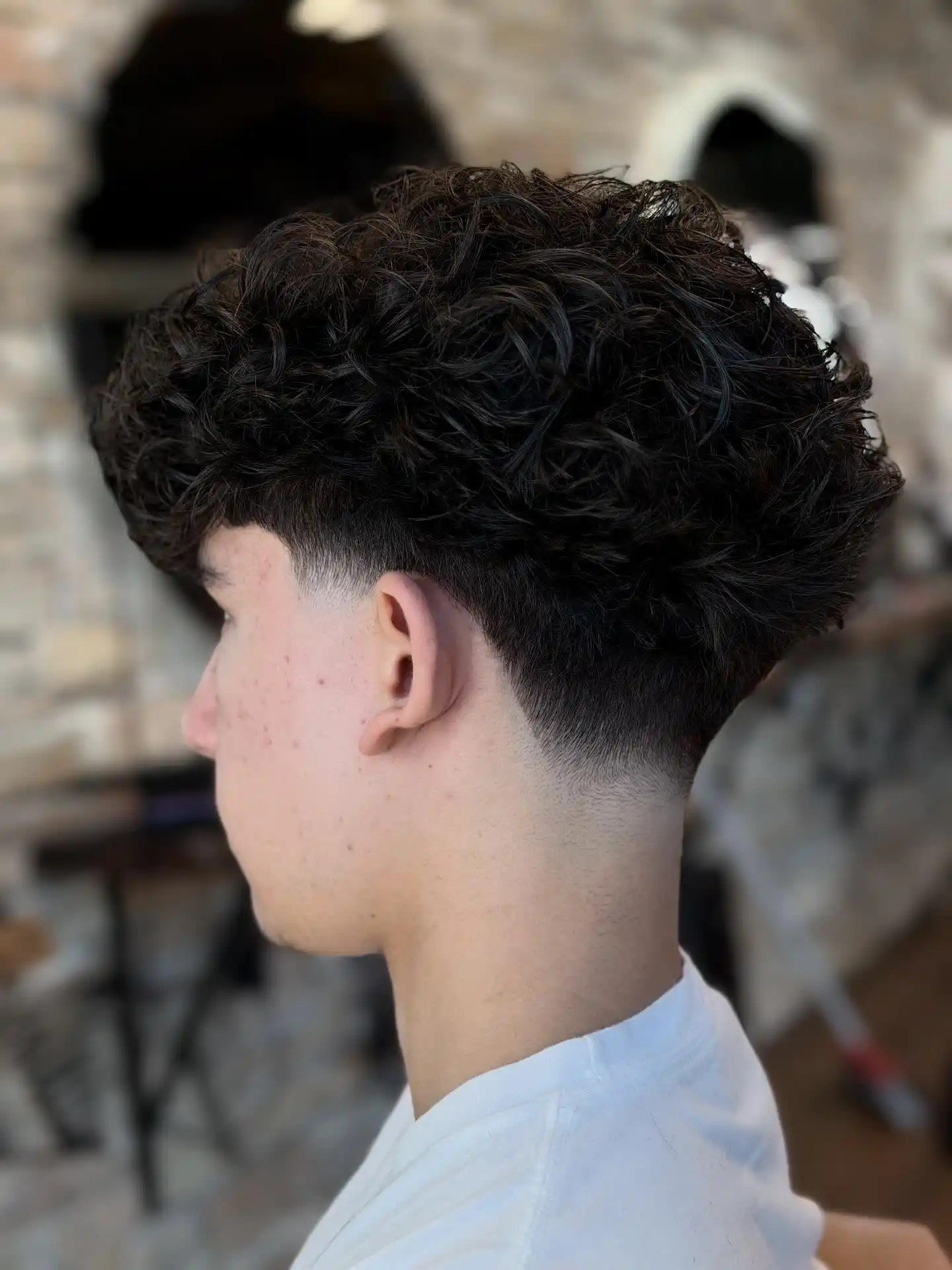 1. The Low Taper That Lets Your Curls Do All the Talking