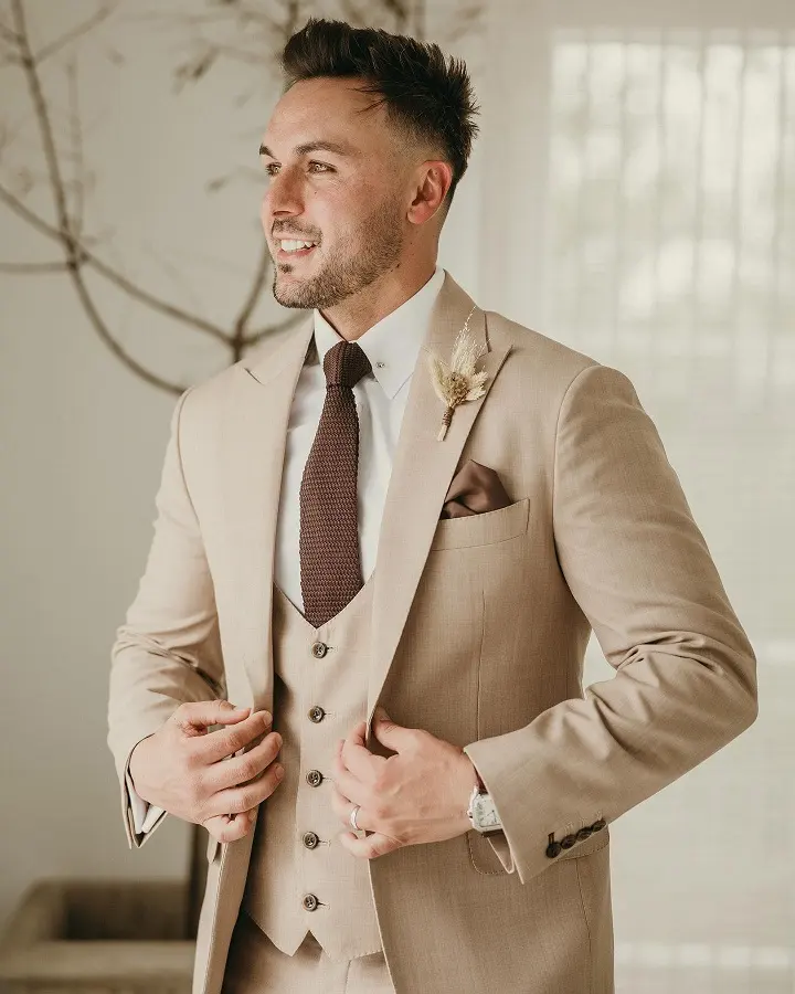 Three Piece Tan Suit With a Knit Tie for a Traditional Ceremony
