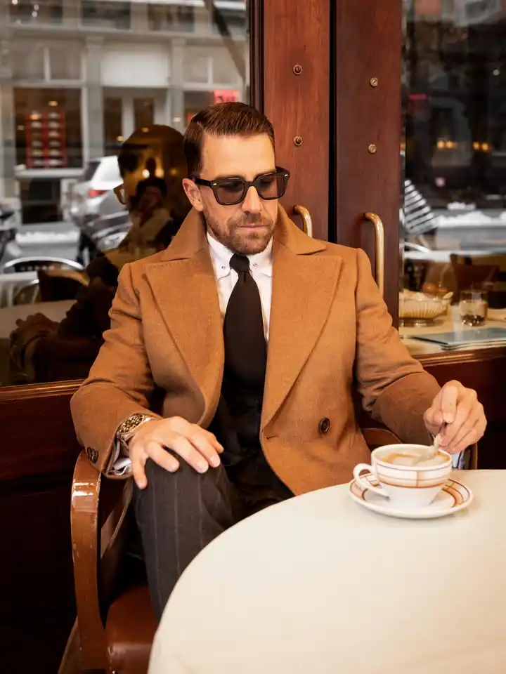 15 Winter Wedding Guest Outfit Ideas for Men 14 12. Camel Overcoat with Pinstripe Trousers