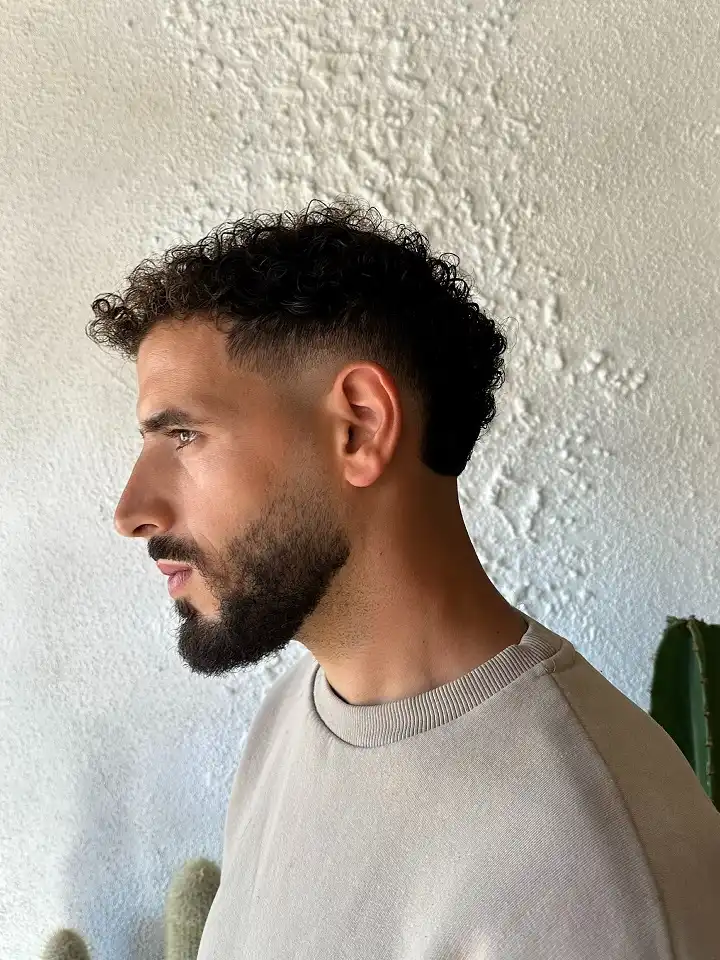 Short Curly Hair for Men: 23 Low-Effort Styles 21 19. Cropped Curl Silhouette With a Steep Side Fade