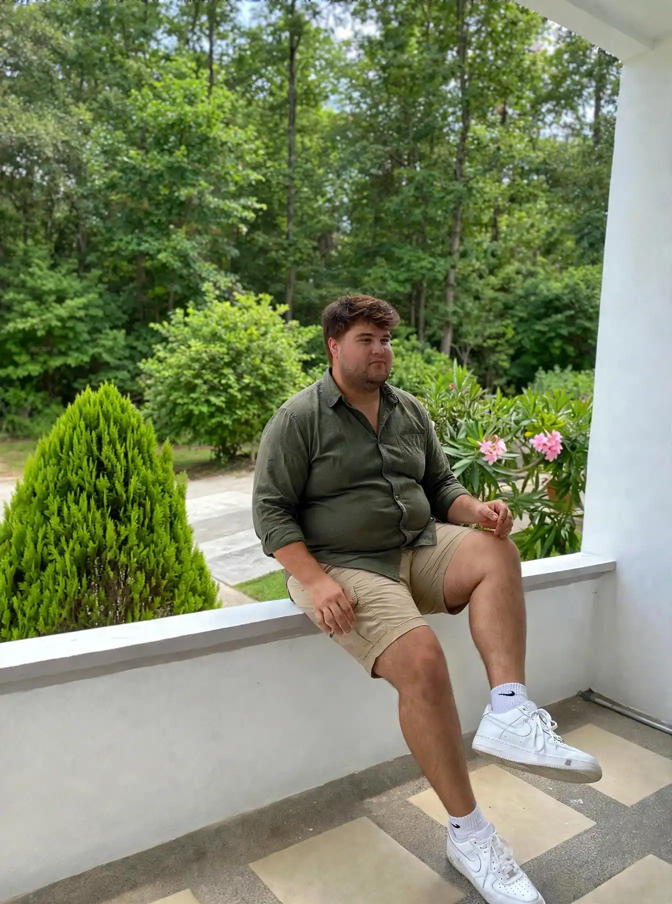 9. Green Shirt and Beige Cargo Shorts