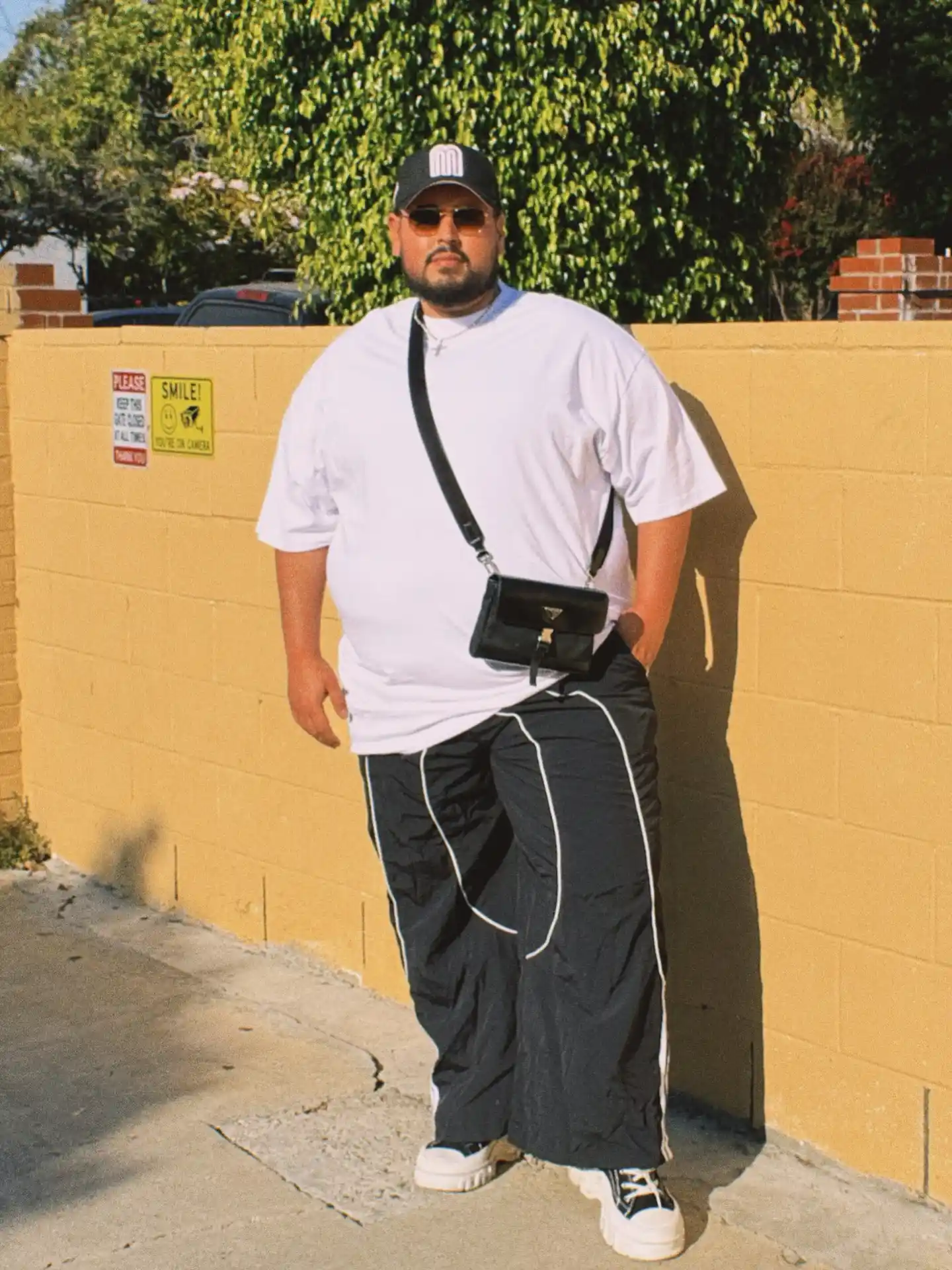 11 Spring Outfits for Plus Size Men Worth Saving Right Now 3 2. Oversized Tee with Wide Leg Track Pants