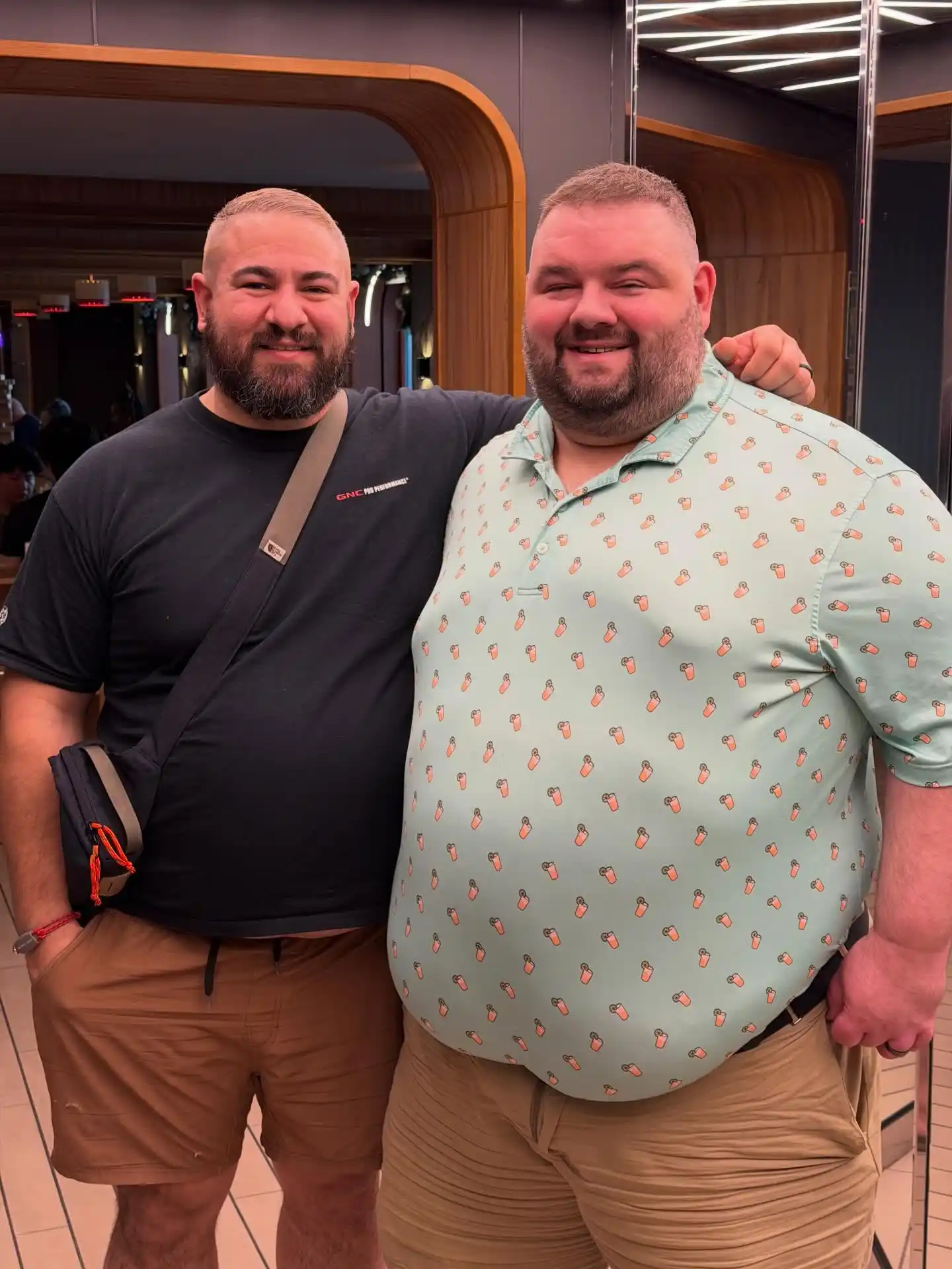 20 Vacation Outfits for Plus Size Men No One Tells You About 15 3. Printed Polo with Tan Shorts