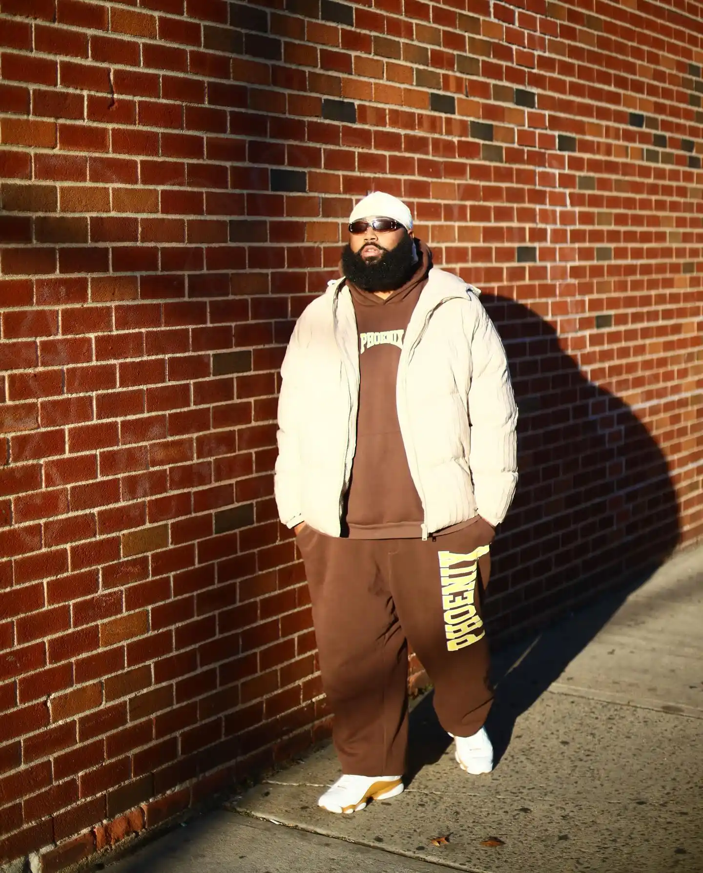 14 Streetwear Outfits for Plus Size Men Real Men Swear By 8 6. Cream Puffer Over Brown Sweatsuit