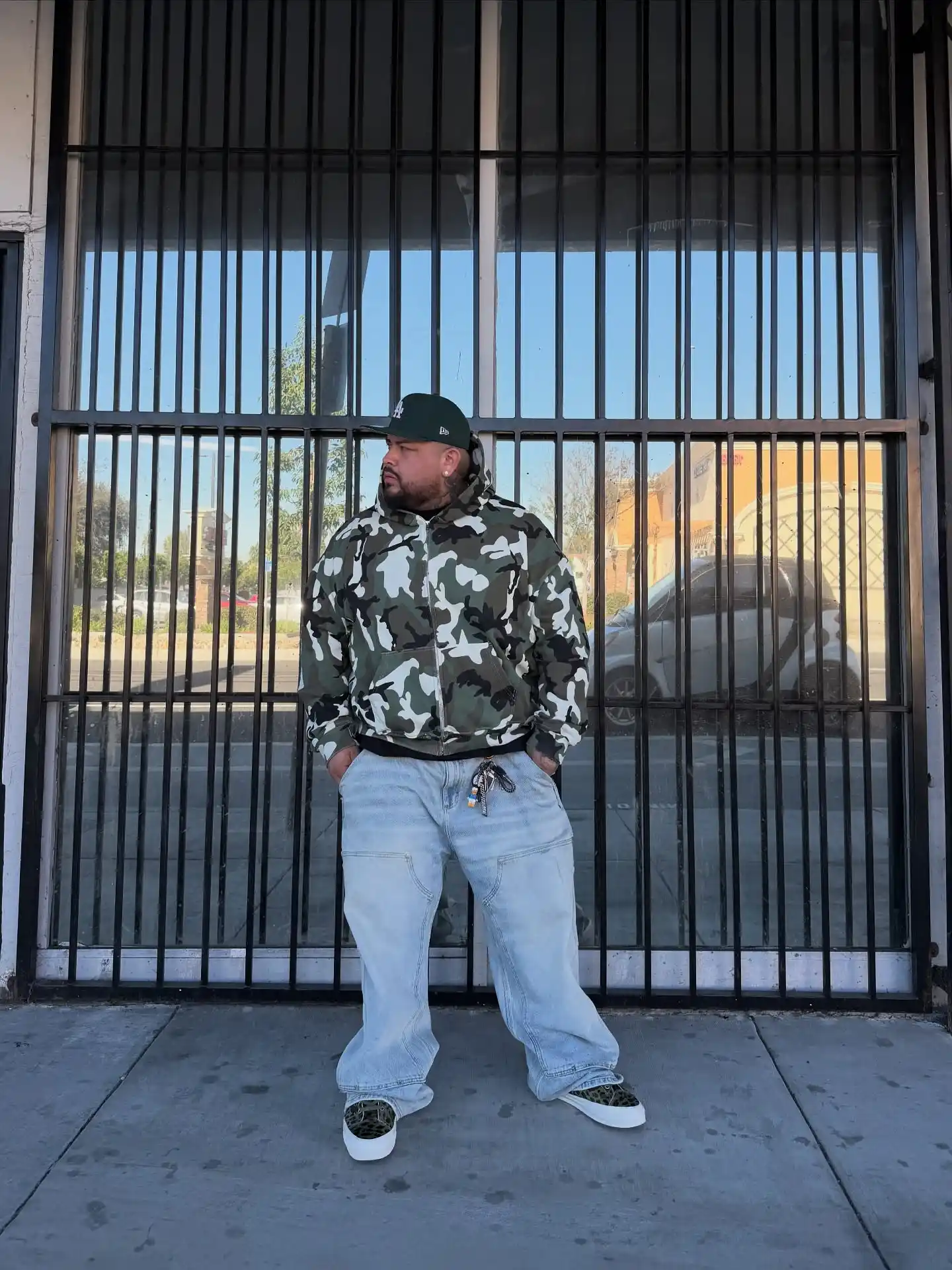 14 Streetwear Outfits for Plus Size Men Real Men Swear By 6 4. Camo Hoodie With Baggy Denim