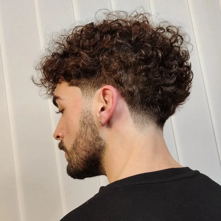 Short Curly Hair for Men: 23 Low-Effort Styles 15 Voluminous Perm-Like Curls With a Low Taper Neckline