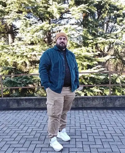24 Travel Outfit Ideas for Plus Size Men Worth Saving Right Now 13 Corduroy Overshirt and Cargo Pants for a Cold Morning of Sightseeing