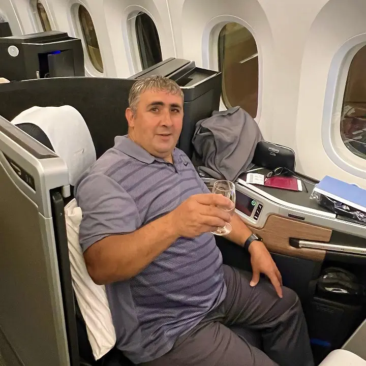 24 Travel Outfit Ideas for Plus Size Men Worth Saving Right Now 10 Striped Polo and Soft Trousers for the Seat You Plan to Sleep In