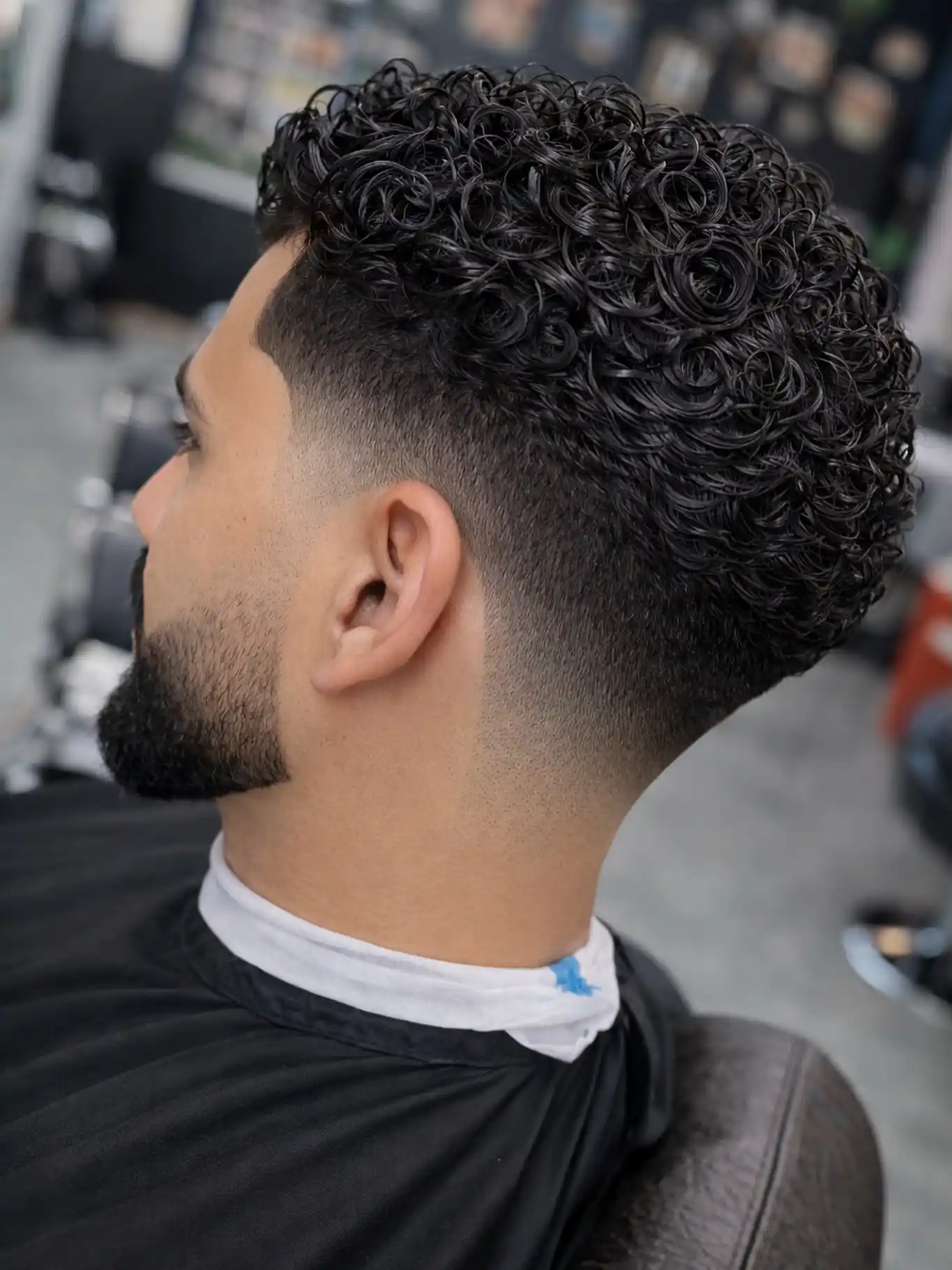 1. Spiral Curl Taper Fade