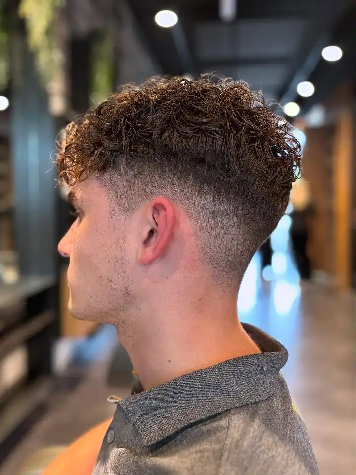 18. Curly Crop With Deep Side Part Fade