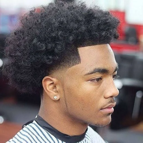 13. The Voluminous Curl Mohawk Fade