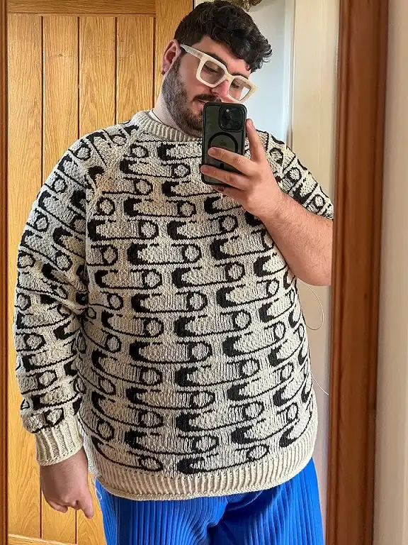 21 Winter Outfit Ideas for Plus Size Men That Actually Work 4 Patterned Chunky Knit With Cobalt Trousers