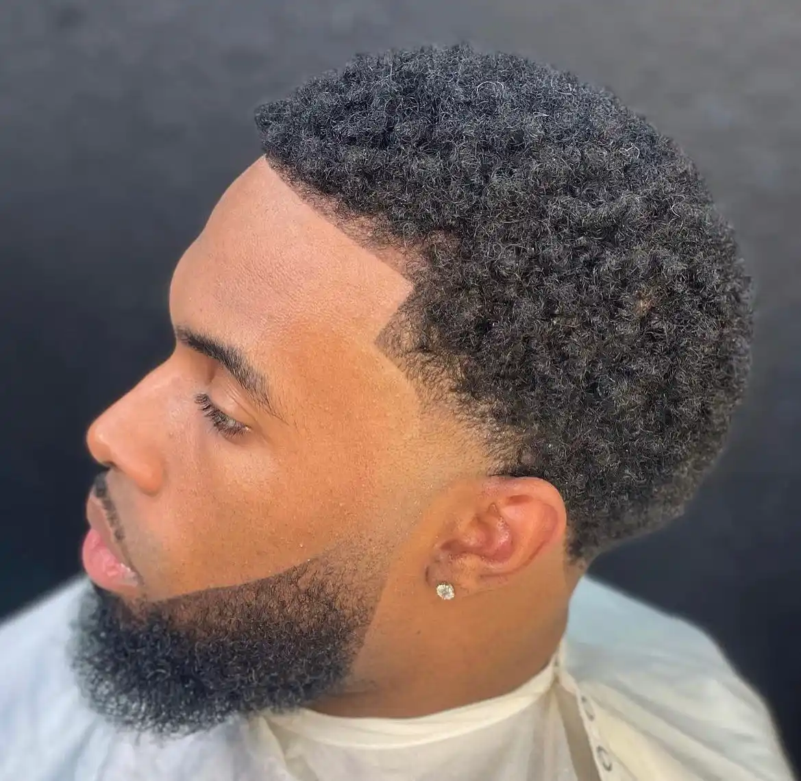 4. The Sharp Cheekline Fade with Full Beard Connection