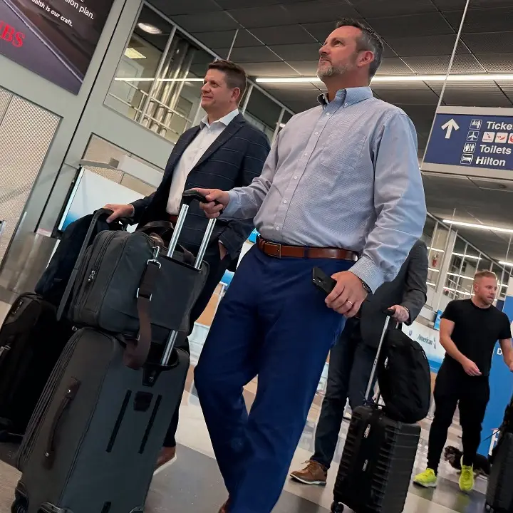 24 Travel Outfit Ideas for Plus Size Men Worth Saving Right Now 9 Oxford Shirt and Navy Trousers for the Work Trip Landing