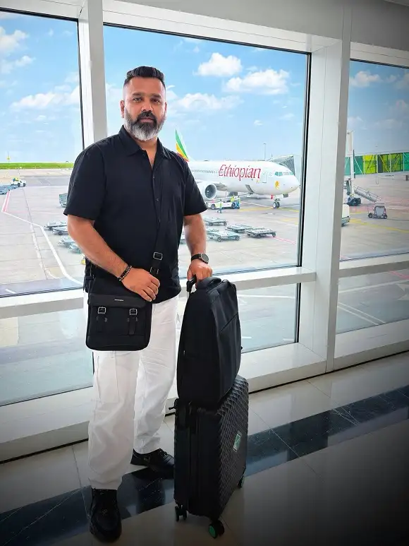 Black Shirt Over White Pants When You Land Somewhere Warm
