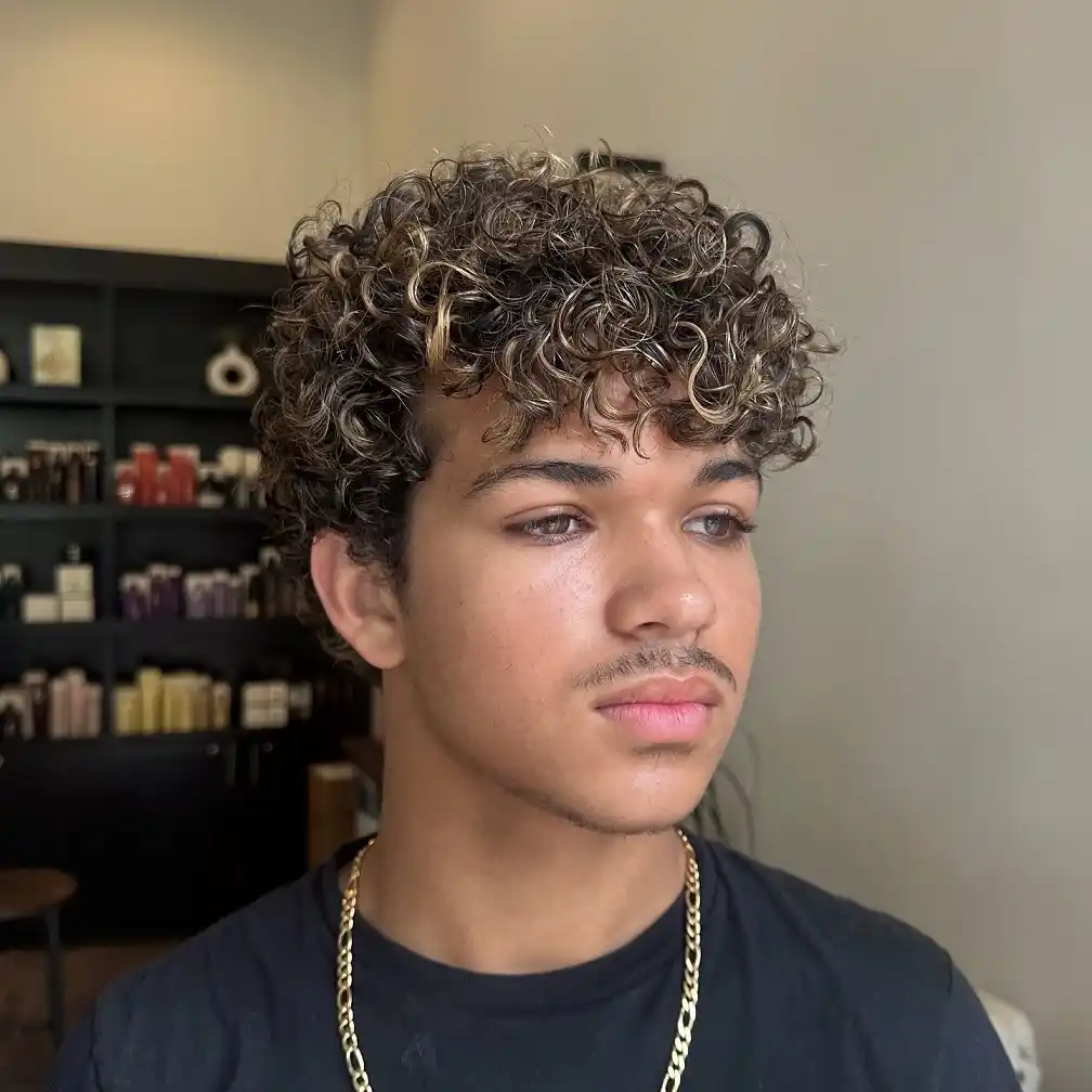 24. Curly Fringe With Face Framing Highlights