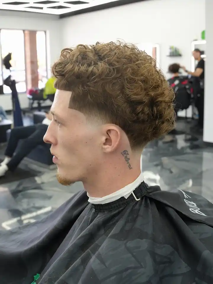 3. Blunt Fringe Curl Top With Drop Fade