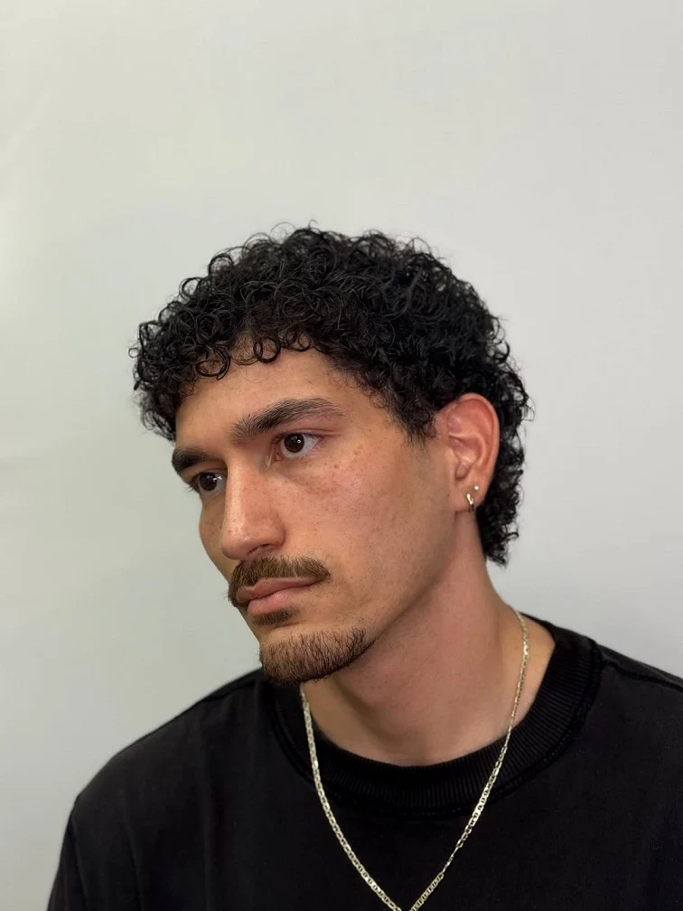 Short Curly Hair for Men: 23 Low-Effort Styles 23 21. Curly Fringe Framing the Face, No Fade in Sight
