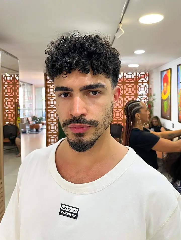 8. Curly Fringe With High Skin Fade