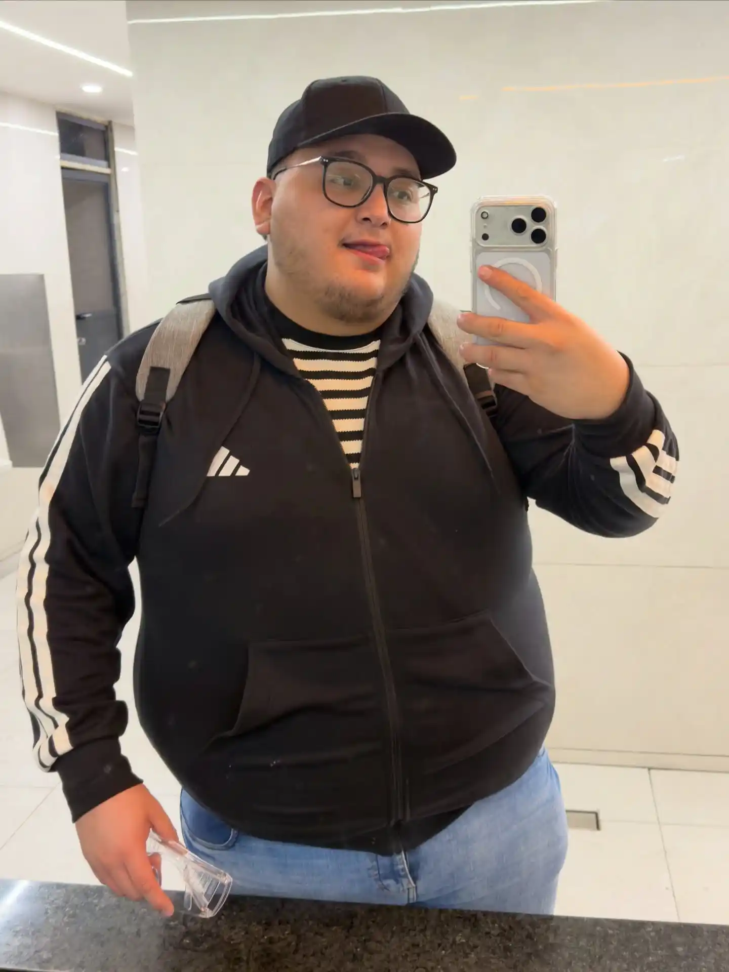 21 Winter Outfit Ideas for Plus Size Men That Actually Work 18 7. Zip Up Track Jacket with Striped Shirt