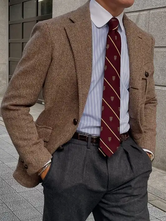 Herringbone Tweed With a Club Collar and Striped Tie