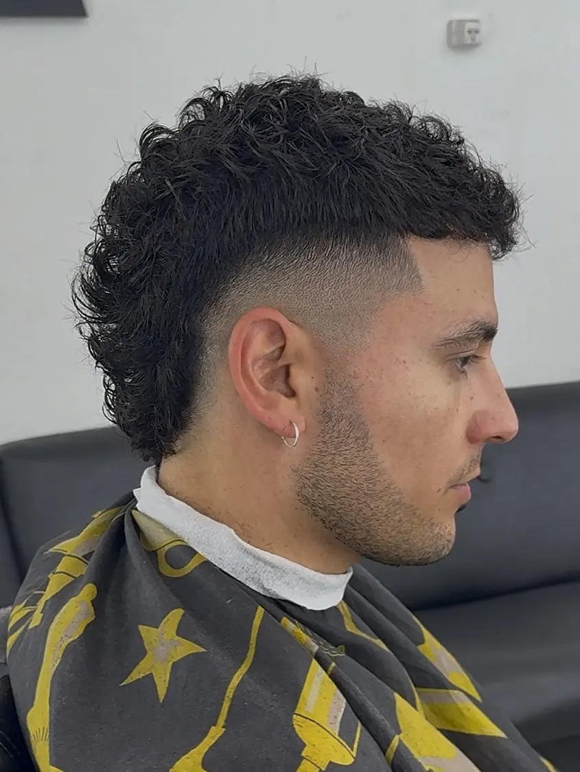 9. Curly Mullet With High Fade