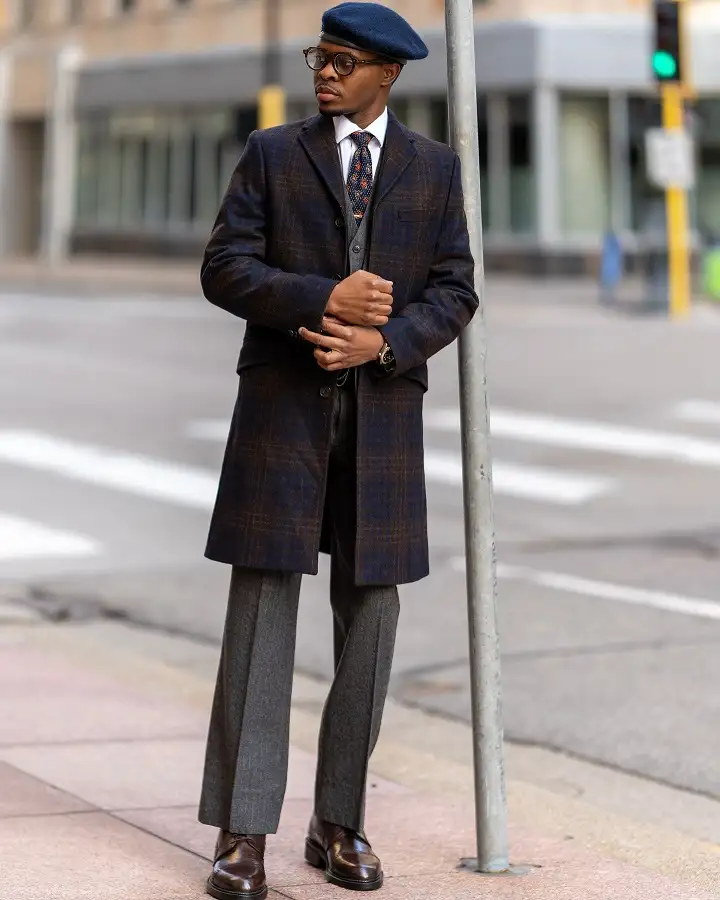 Checked Overcoat, Beret and Grey Flannels