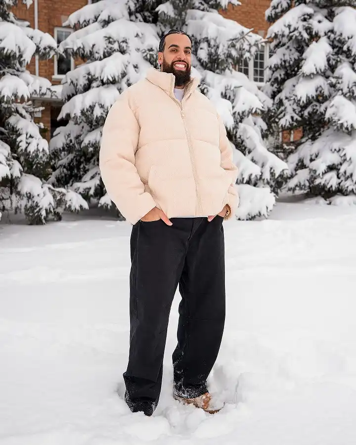 21 Winter Outfit Ideas for Plus Size Men That Actually Work 11 Cream Sherpa Puffer With Wide Black Work Pants