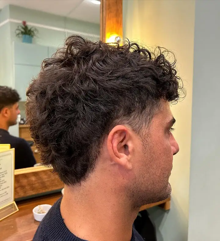 Short Curly Hair for Men: 23 Low-Effort Styles 22 20. The Curly Mullet-Inspired Cut With Extra Length in Back