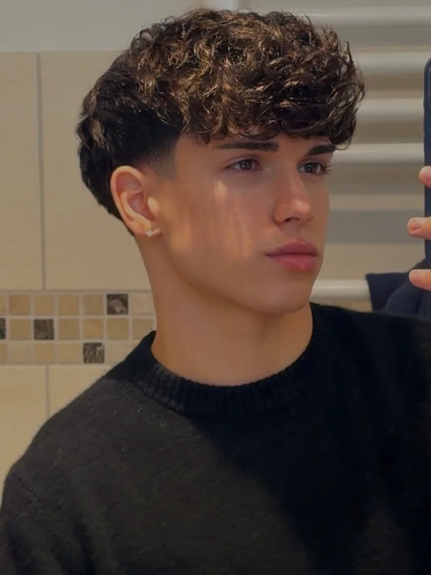 Short Curly Hair for Men: 23 Low-Effort Styles 3 The Curly Crop With a Low Taper Fade