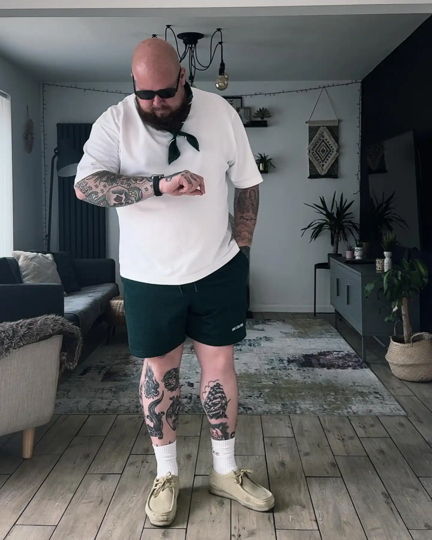 4. White T-Shirt with Dark Green Athletic Shorts
