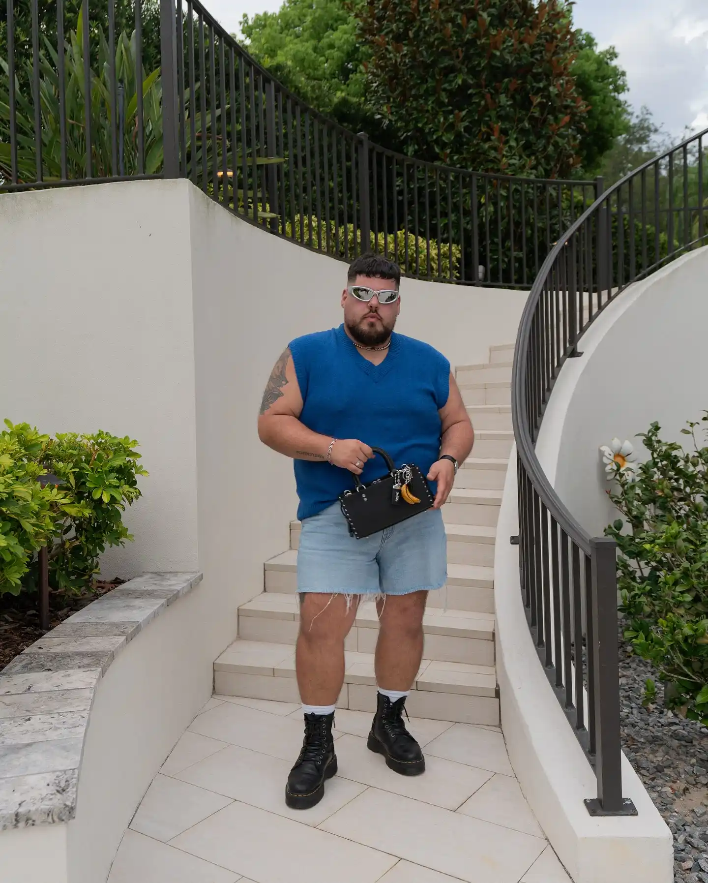 2. Blue Sweater Vest with Denim Cutoff Shorts