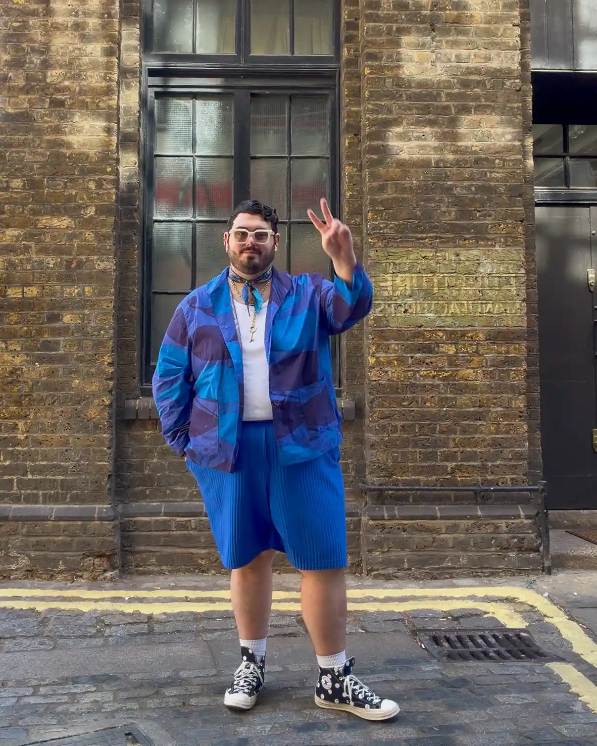 3. Printed Jacket with Pleated Blue Shorts