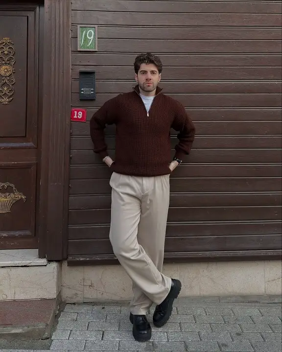 21 Capsule Workwear Outfits for Men (Minimal Office Style) 7 Brown Half Zip Sweater With Cream Trousers