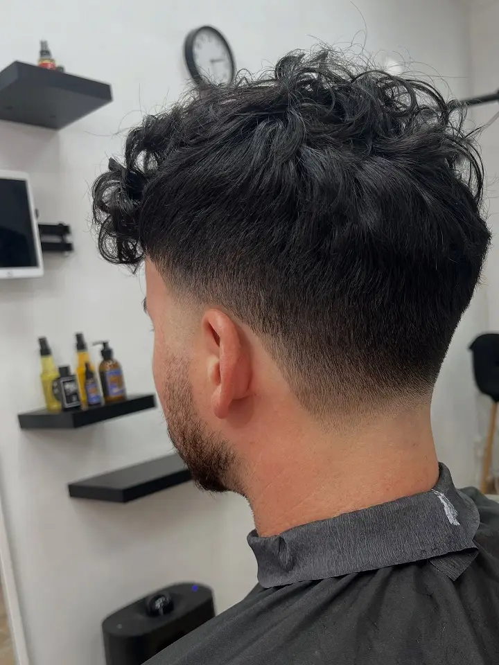 Short Curly Hair for Men: 23 Low-Effort Styles 24 22. Undercut Curls Left Long on Top for a Wild, Piled-Up Look