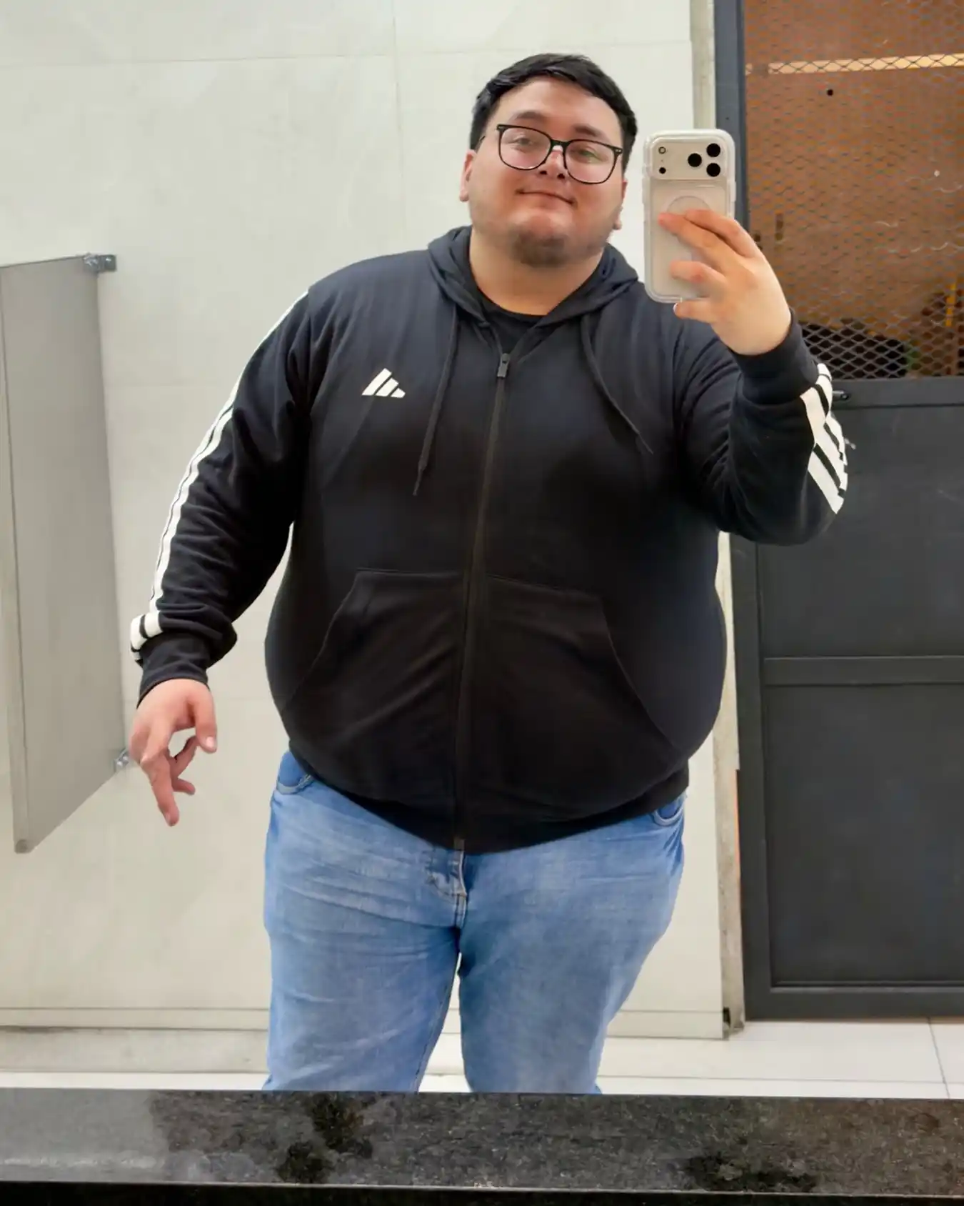 3. Black Track Style Hoodie With Blue Jeans