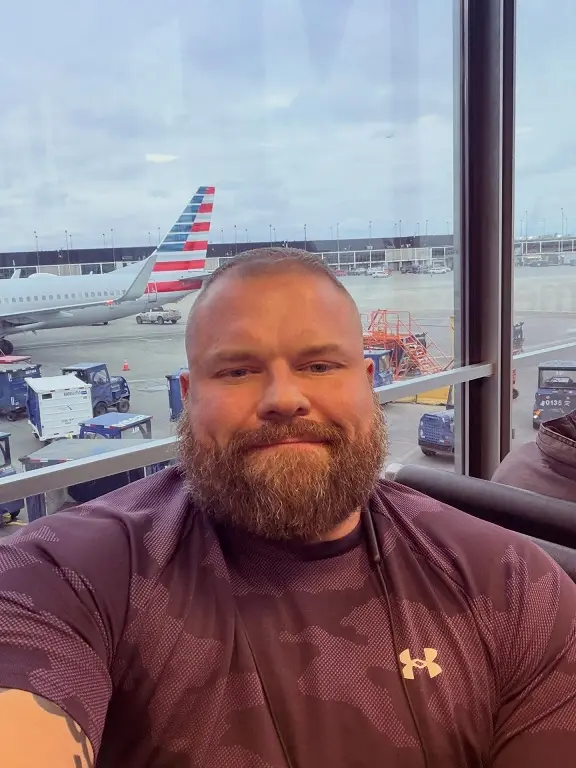 24 Travel Outfit Ideas for Plus Size Men Worth Saving Right Now 6 The Stretch Performance Tee That Survives a Long Gate Wait